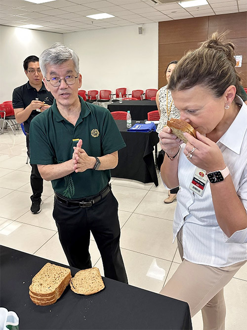 Dr Larisa Cato and Massimo assess bread products